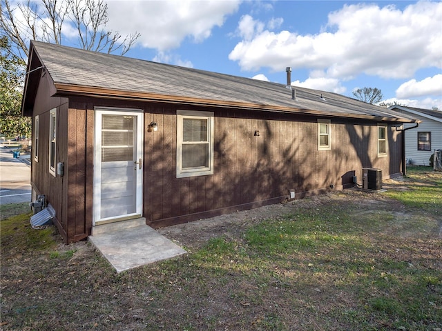 back of property featuring central air condition unit