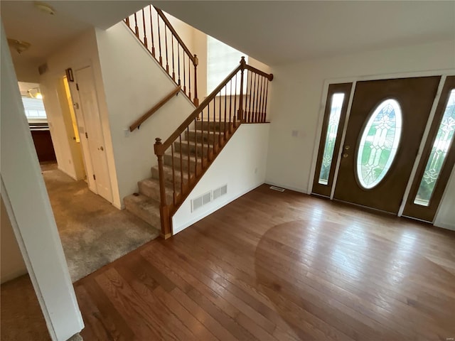 entrance foyer with carpet