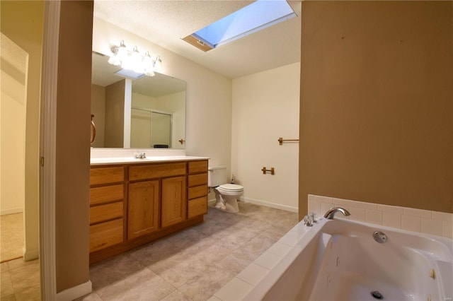 bathroom with a skylight, tile patterned flooring, a bath, toilet, and vanity