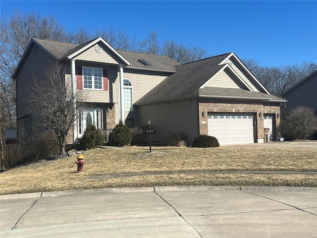 view of front facade with driveway, brick siding, an attached garage, and a shingled roof