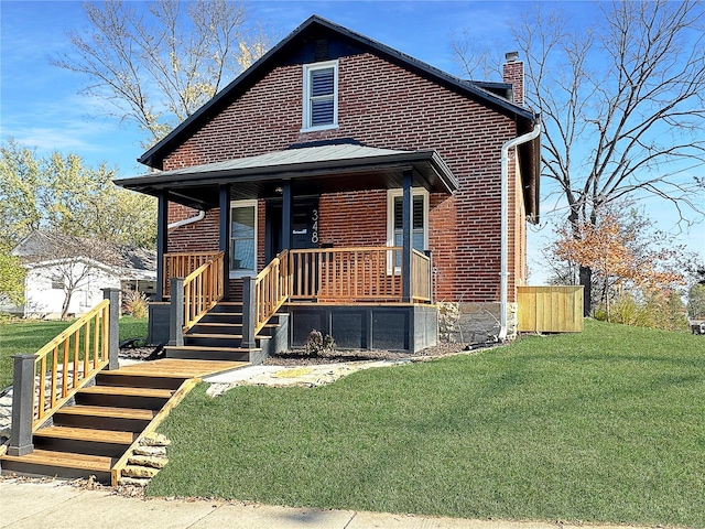 view of front of house with a porch and a front lawn