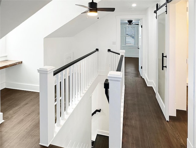 interior space featuring a barn door and hardwood / wood-style flooring