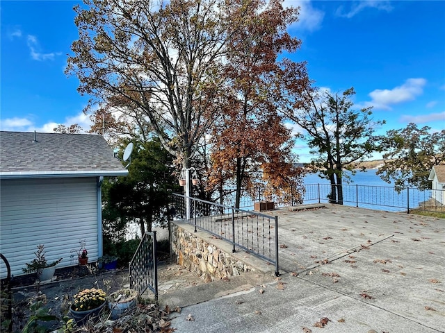 exterior space with a water view