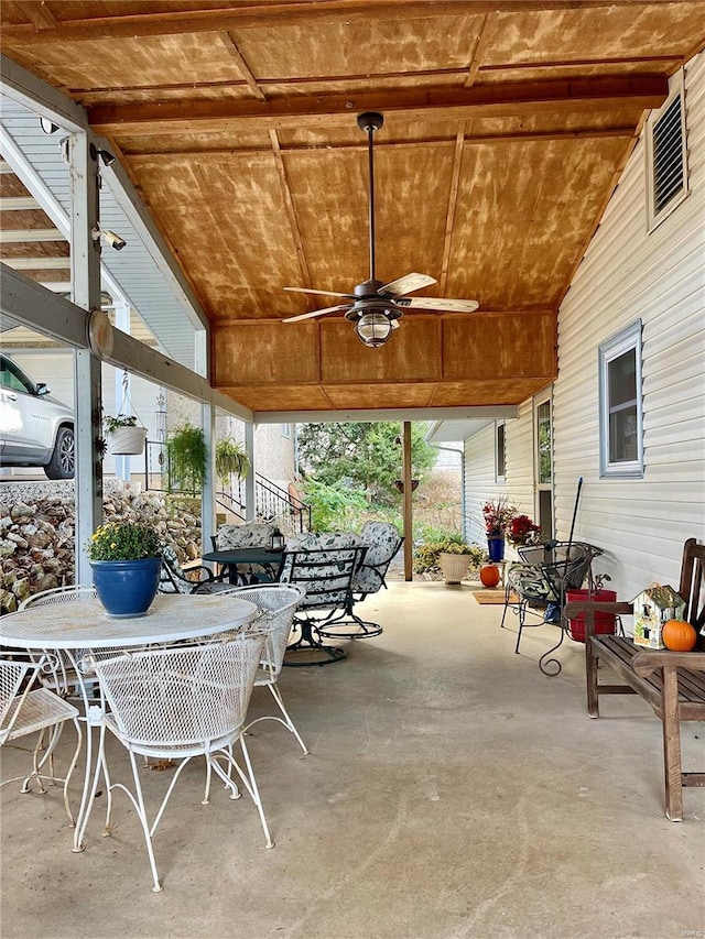 view of patio featuring ceiling fan