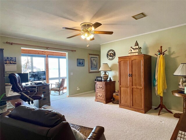 living room with ceiling fan, light carpet, and crown molding