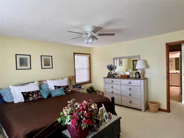 bedroom with light carpet and ceiling fan