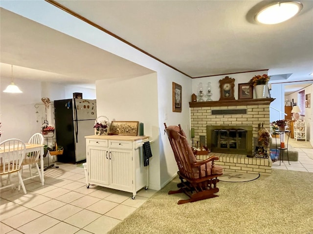 tiled living room featuring a fireplace and crown molding