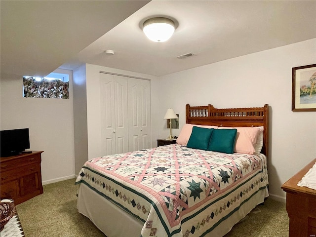 bedroom featuring a closet and carpet floors