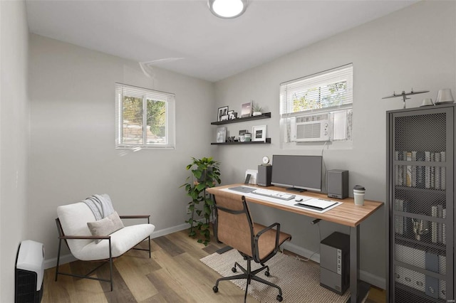 office space featuring light hardwood / wood-style flooring and cooling unit