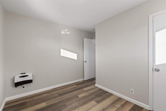 spare room featuring dark hardwood / wood-style flooring