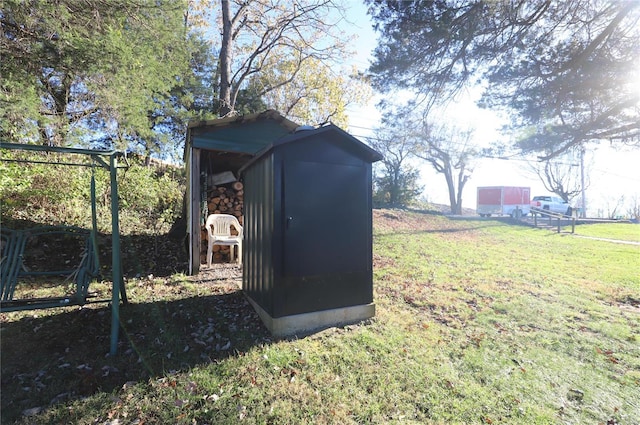 view of outdoor structure featuring a lawn