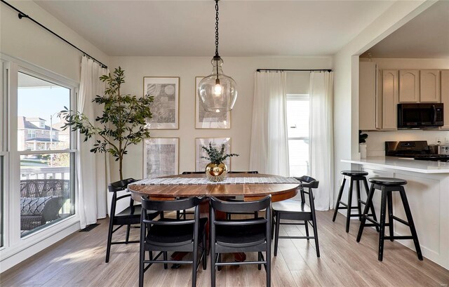 dining room featuring light wood-type flooring