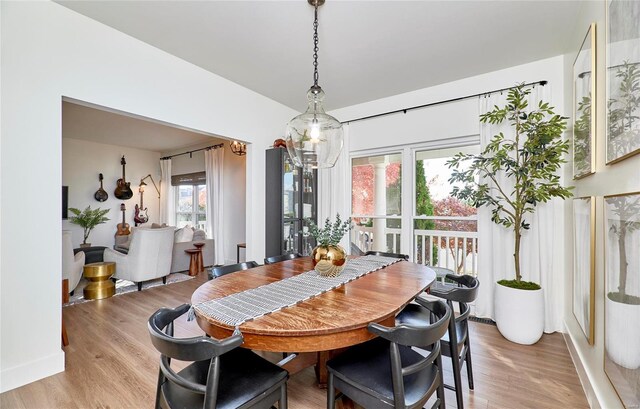 dining area with a healthy amount of sunlight and light wood-type flooring