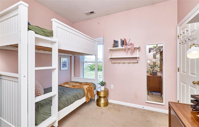 bedroom with light colored carpet