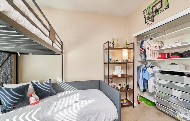 carpeted bedroom with a closet