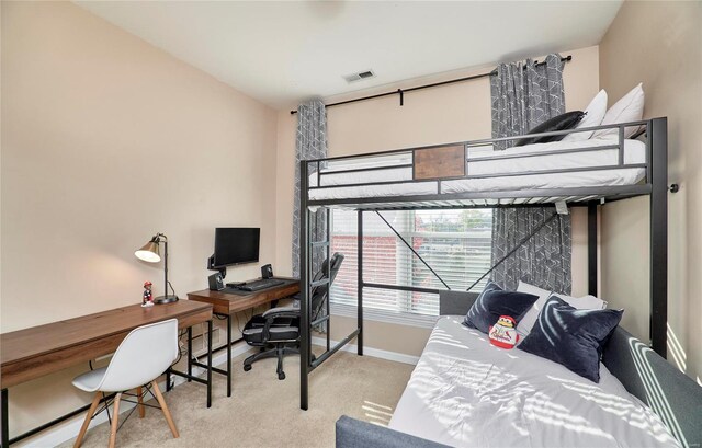 bedroom featuring light colored carpet