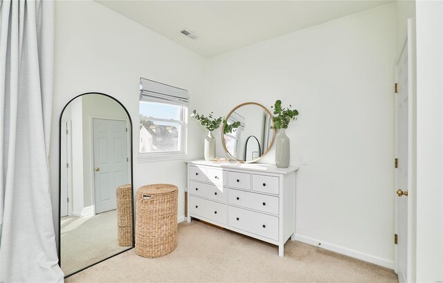 bedroom featuring light colored carpet