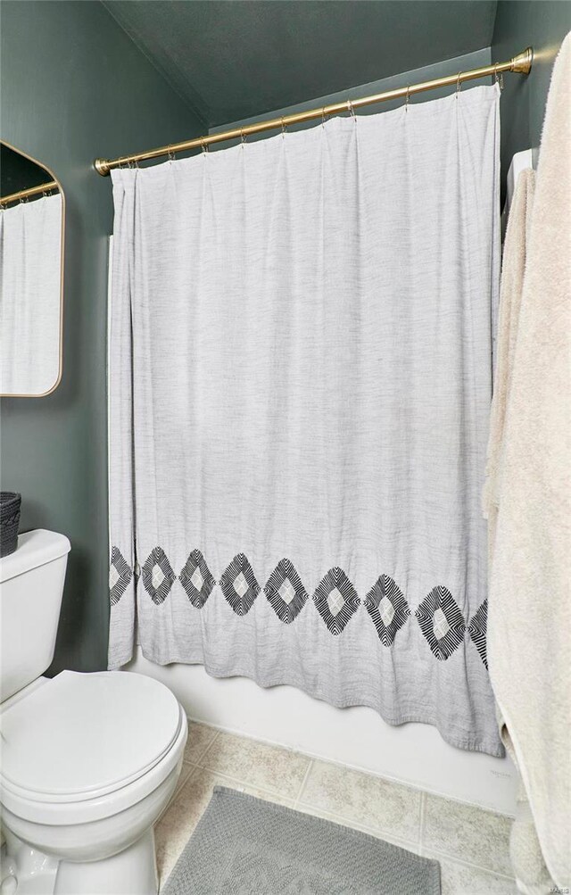 bathroom with tile patterned flooring and toilet