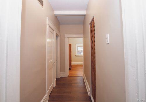 hall with dark hardwood / wood-style floors