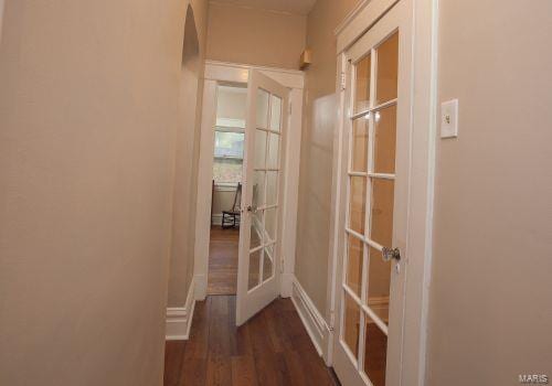 hall featuring french doors and dark hardwood / wood-style flooring