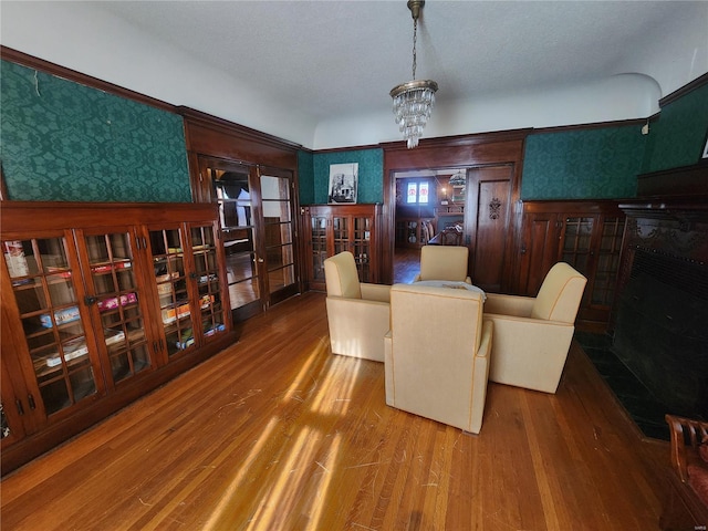 dining space featuring wood-type flooring and a chandelier