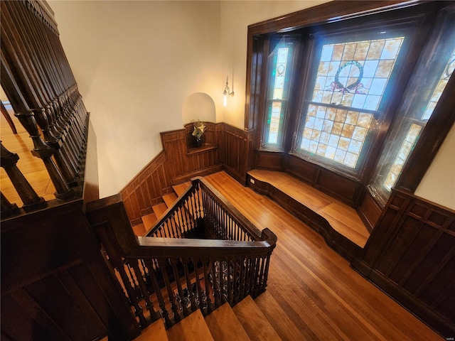 staircase with hardwood / wood-style flooring