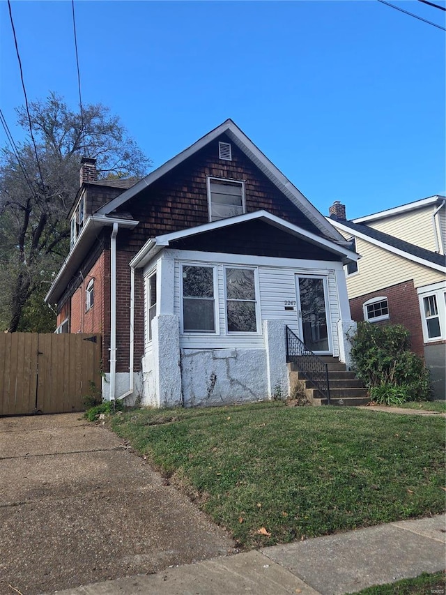 bungalow with a front yard