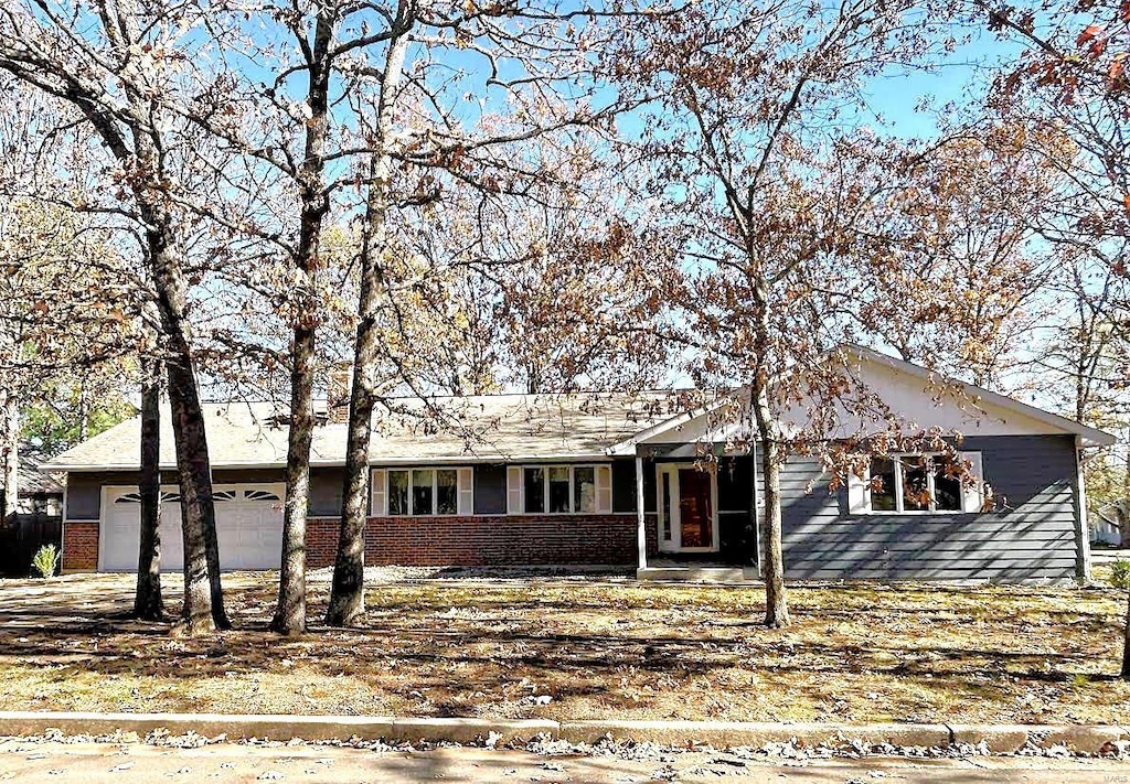 ranch-style home featuring a garage