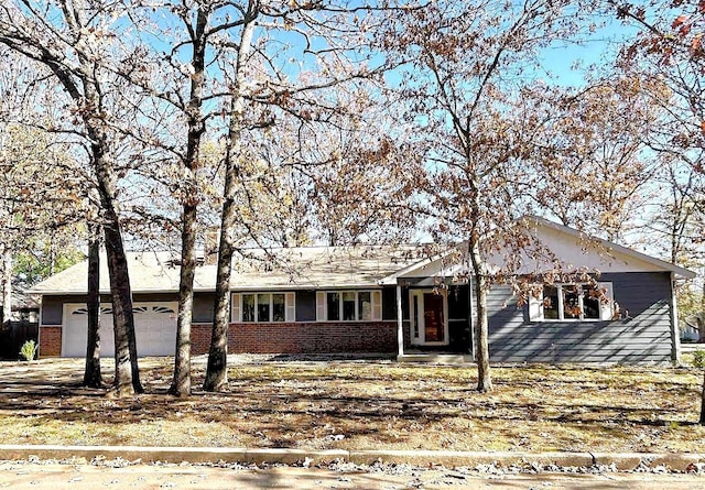 ranch-style home featuring a garage