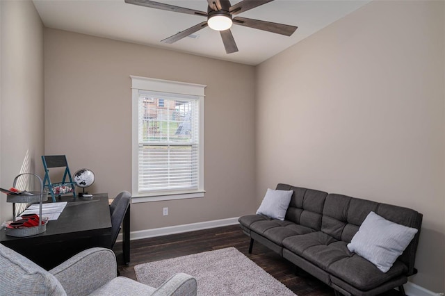 office space featuring ceiling fan and dark hardwood / wood-style floors