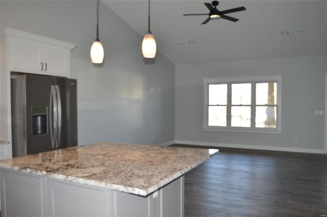 kitchen with white cabinetry, stainless steel refrigerator with ice dispenser, lofted ceiling, pendant lighting, and dark hardwood / wood-style flooring