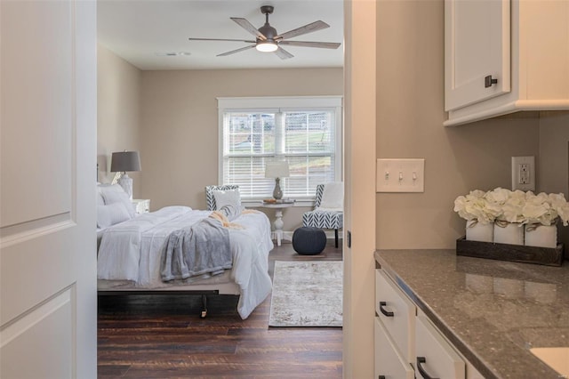 bedroom featuring dark wood-type flooring and ceiling fan