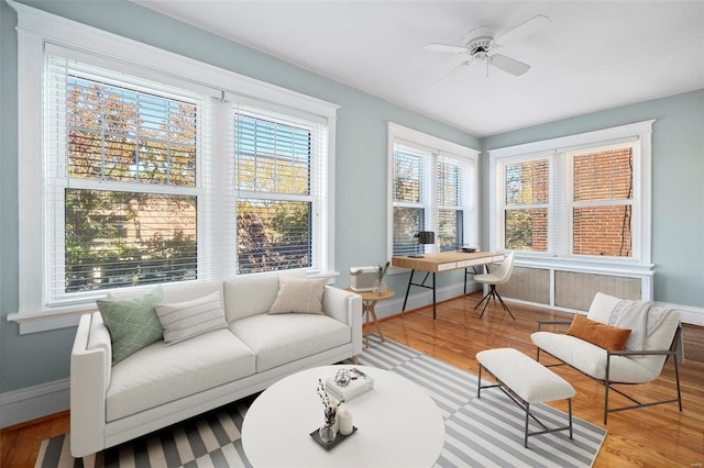 sunroom / solarium with ceiling fan and a healthy amount of sunlight