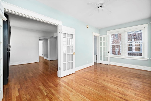 unfurnished room with wood-type flooring and ceiling fan