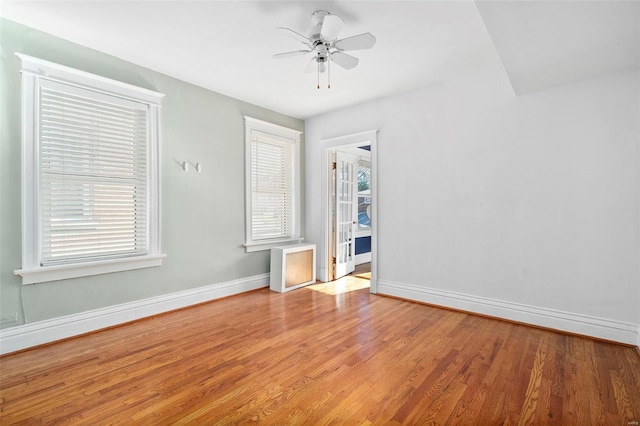 unfurnished room featuring light hardwood / wood-style floors and ceiling fan