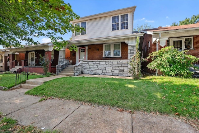 view of front of home featuring covered porch and a front yard