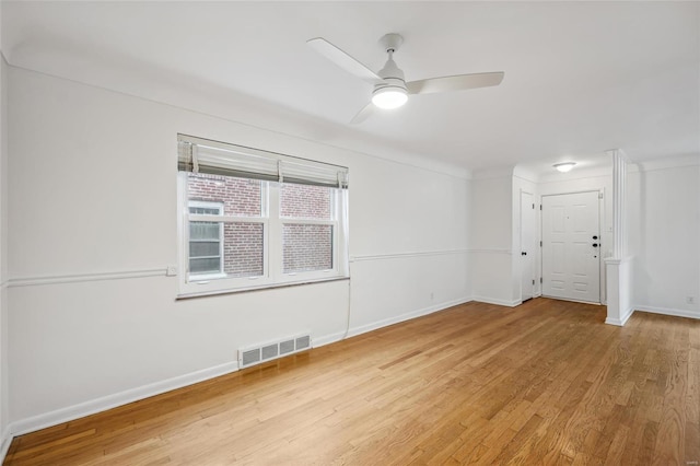 spare room featuring ceiling fan and light hardwood / wood-style flooring