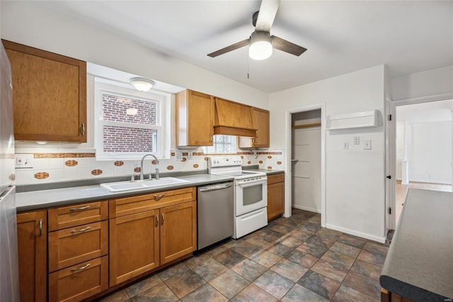 kitchen featuring backsplash, white range with electric cooktop, dishwasher, and sink