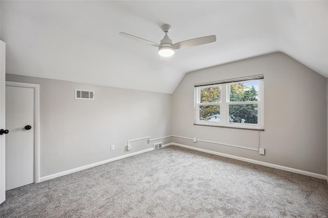 additional living space featuring carpet flooring, ceiling fan, and lofted ceiling