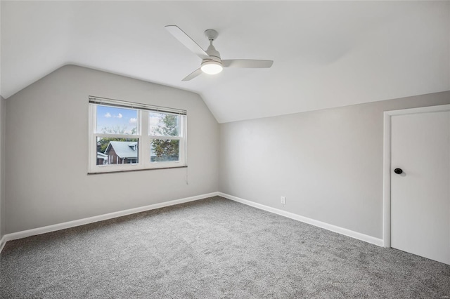 bonus room with carpet flooring, vaulted ceiling, and ceiling fan