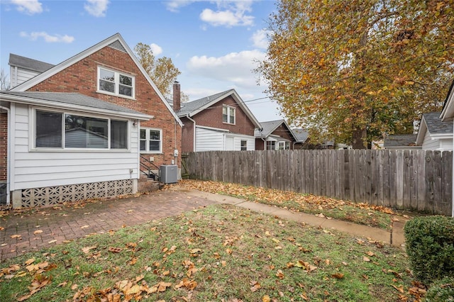 back of house featuring a patio and central air condition unit