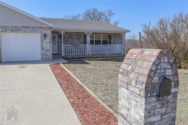 single story home with a porch, roof with shingles, concrete driveway, an attached garage, and brick siding