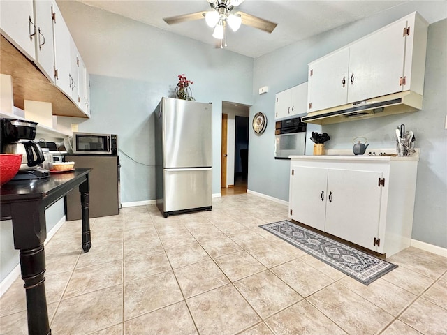 kitchen with white cabinets, ceiling fan, light tile patterned floors, and appliances with stainless steel finishes