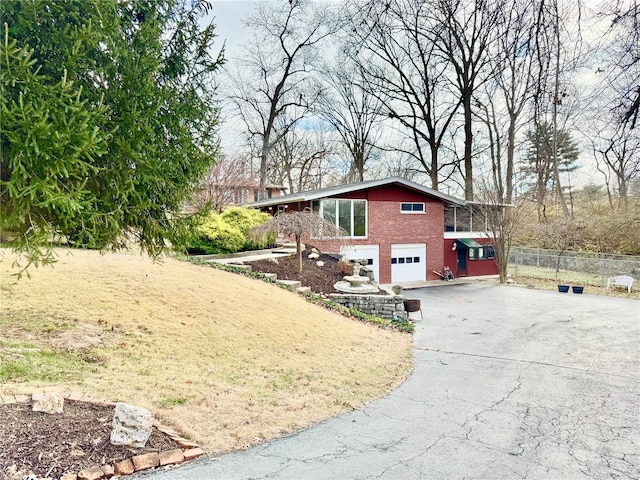 view of side of property with a garage