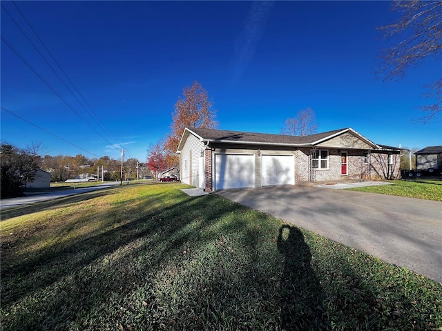 view of front of house with a garage and a front yard