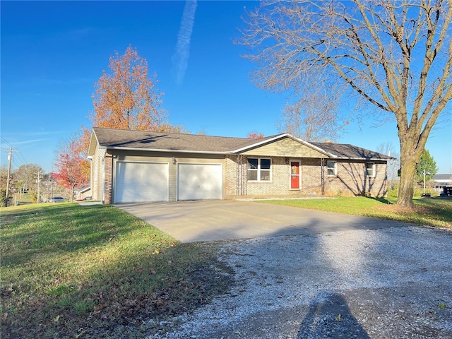 single story home with a front lawn, brick siding, driveway, and an attached garage