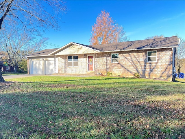 ranch-style home featuring a garage, a front yard, concrete driveway, and brick siding