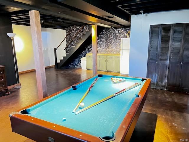 playroom with finished concrete flooring and billiards