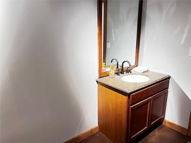 bathroom with baseboards and vanity