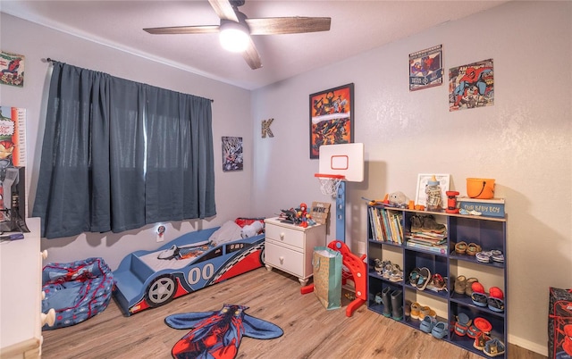 bedroom featuring ceiling fan and wood-type flooring